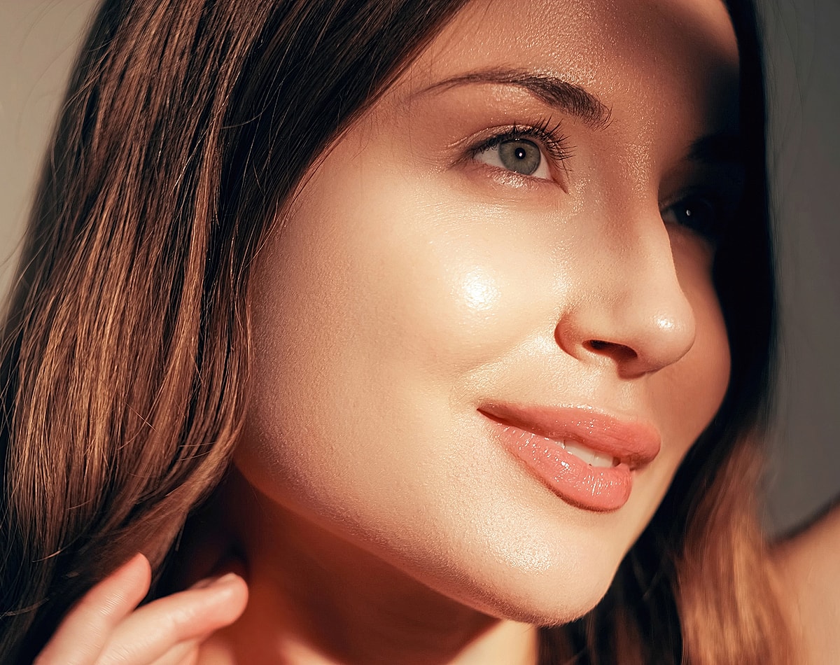 Close-up of a Lafayette facial plastic surgery model with glowing skin.